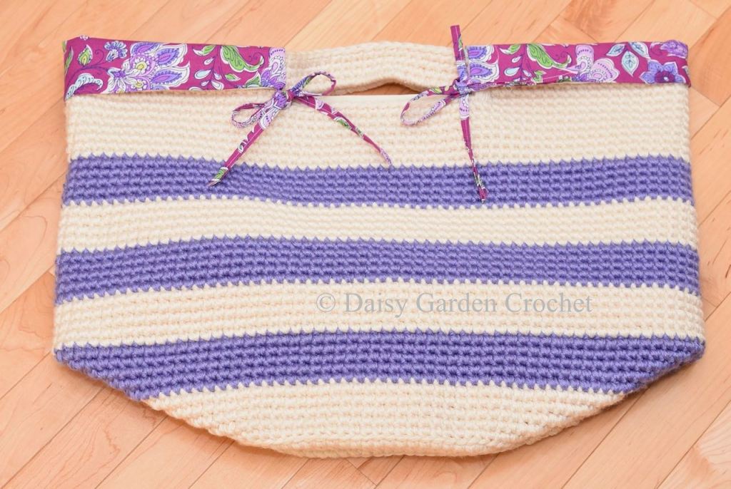 Crochet basket with handle with decorative fabric liner