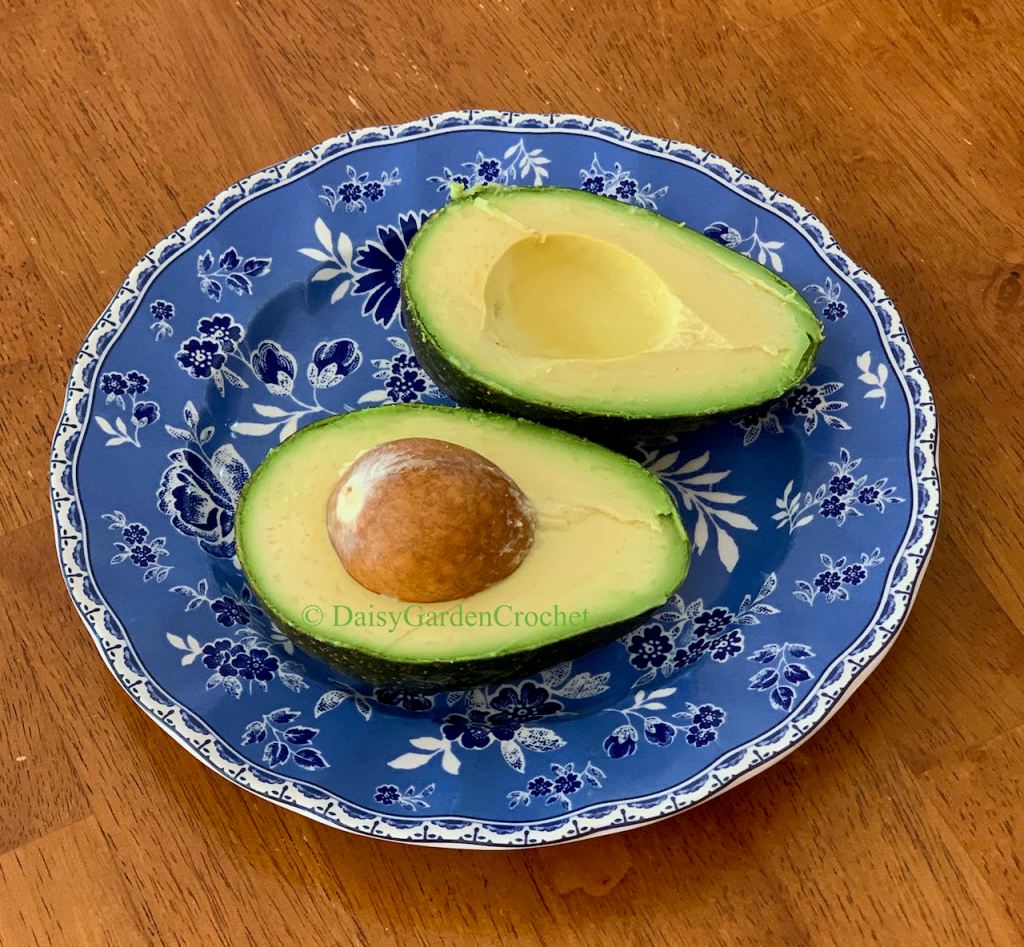 Avocado cut open showing no black spots or bruising