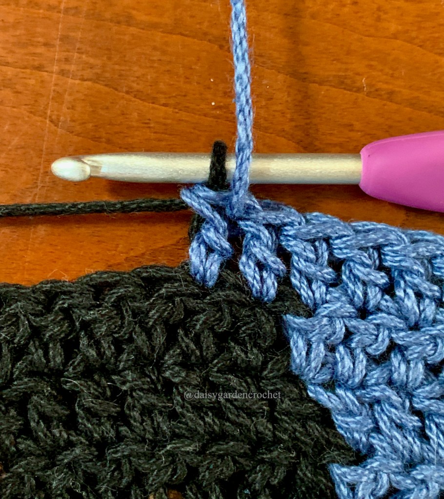 Step 4 in making a blended double crochet color change